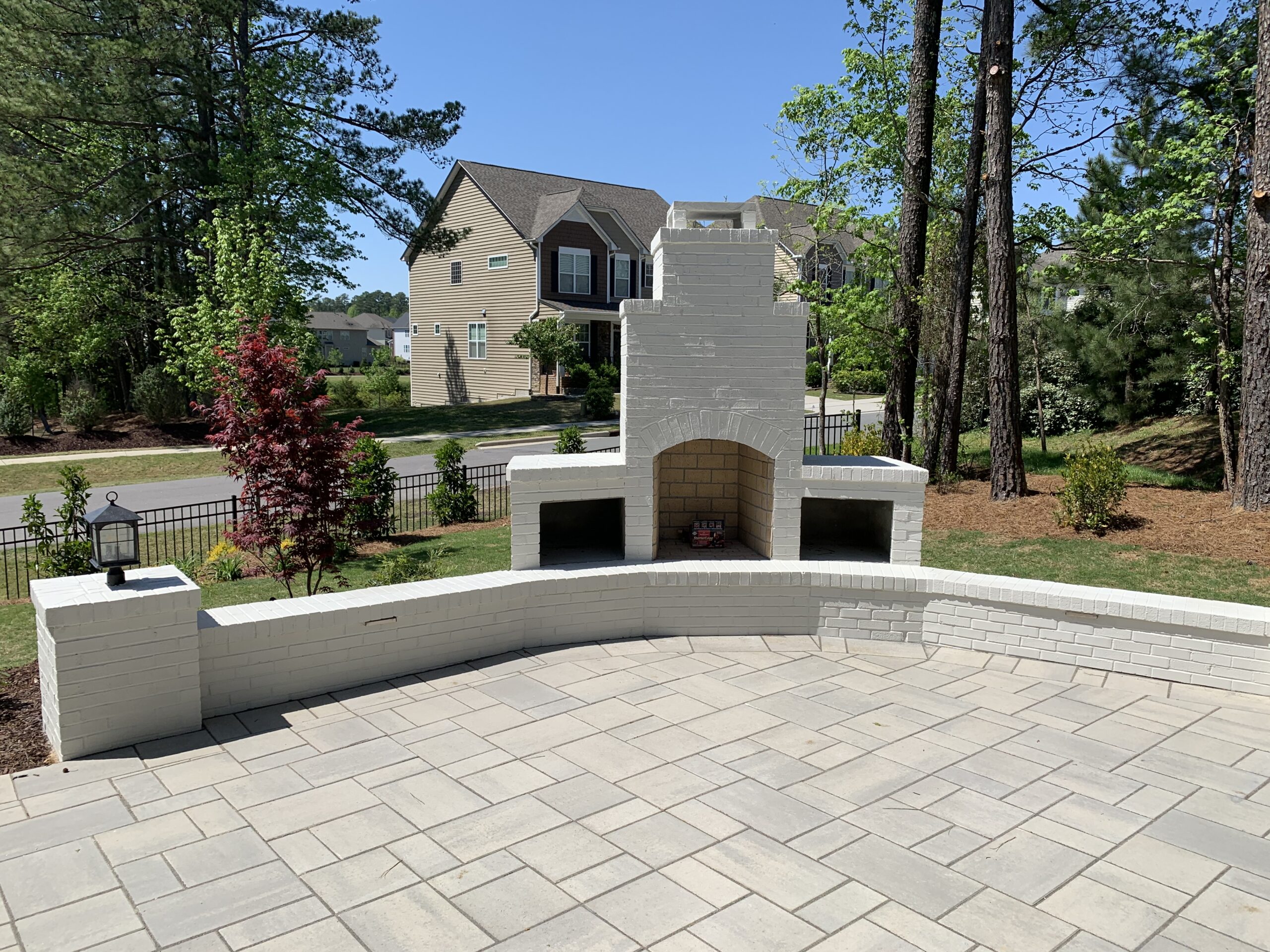 Outdoor brick fireplace with seating